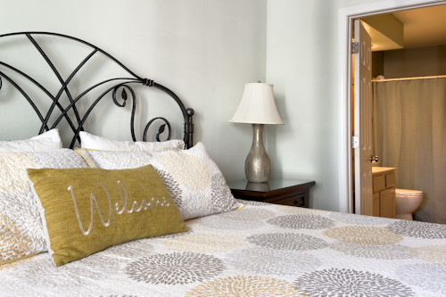 A welcoming guest bedroom can be found in this Pointe Royale Branson condo.