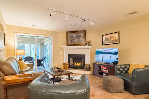 This Pointe Royale Branson condo has a living room attached to the sunroom.
