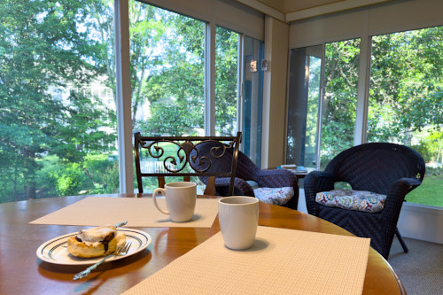 The sunroom is ready for you to sit and enjoy your morning.